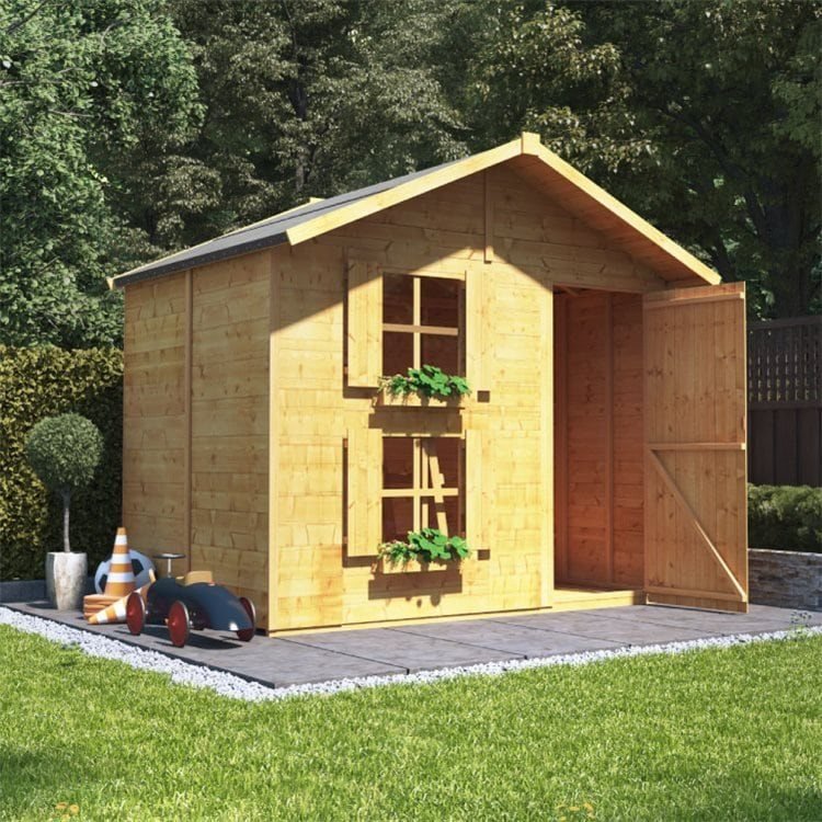 Peardrop Extra two-storey playhouse in a grassy garden