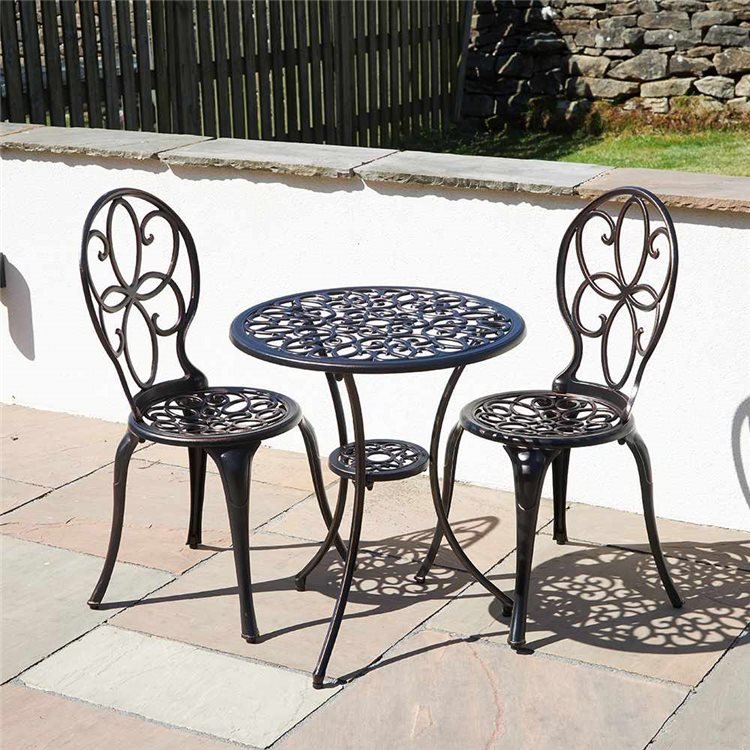 Aluminium chair and table set on a small patio