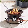 Gas Fire Pit bowl with roaring flame on patio slabs.