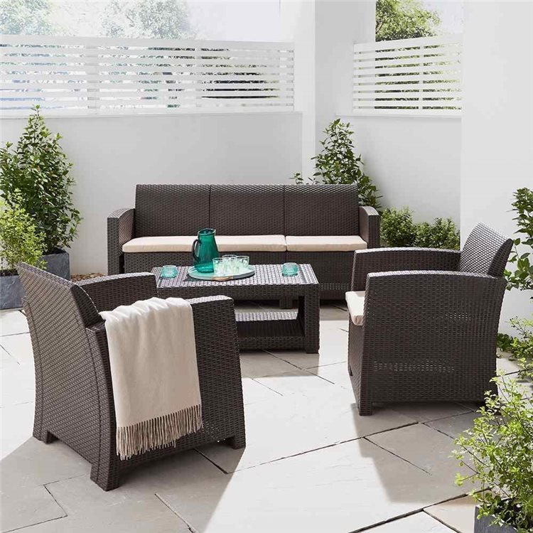 5 Seater Rattan Sofa and Armchair set in closed-in modern garden